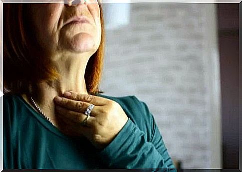 Woman suffering from laryngitis