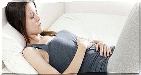 Woman experiencing abdominal pain