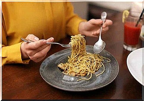 Person eating pasta