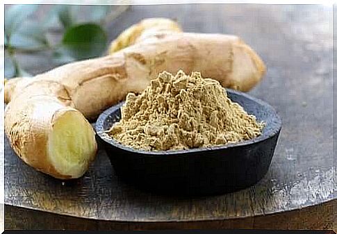 Bowl with ginger powder to relieve toothache