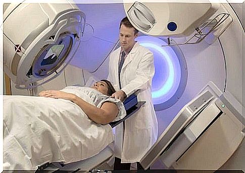 Doctor preparing a patient for a radiotherapy session