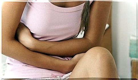 Woman showing symptoms of gastroduodenal ulcer