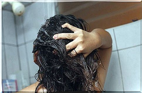 Applying curly hair masks in the shower