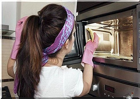 Housewife removing unpleasant odors from the kitchen