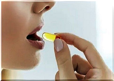 Woman taking a vitamin K supplement